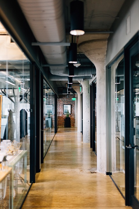 Modern industrial office hallway with exposed ceilings